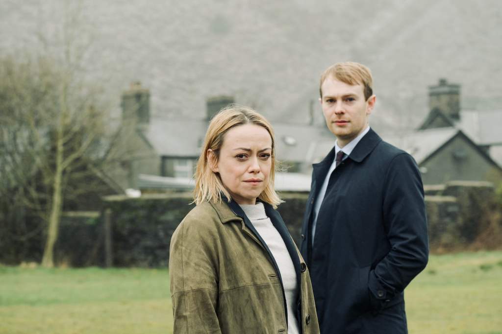 Two people standing outdoors, cloudy background.
Hidden image airs on iPlayer