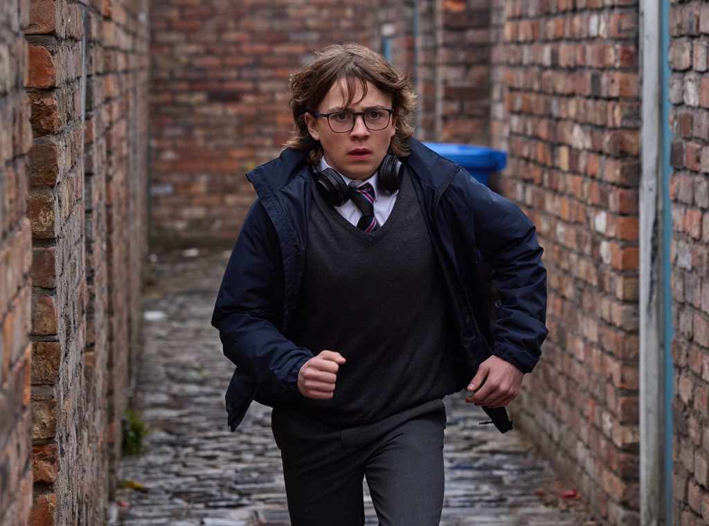 Sam running in Corrie