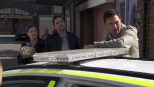 Carl and police in Corrie